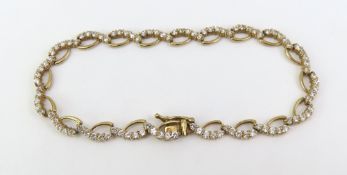 A 9ct gold CZ set bracelet, the open links with st