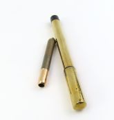 An F Soennecken gold cased cartridge fountain pen with speckled