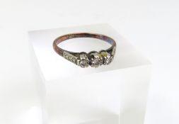 An early to mid-20th century three stone diamond r