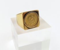 A gold square head heavy ring set with a Mexican D