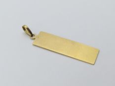 An unmarked ingot shaped pendant