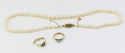A sapphire and white stone dress ring, marked '14k