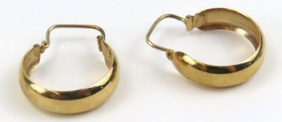 A pair of 9ct gold hoop earrings 0.5cm wide, 2.1cm long, 1.9g gross