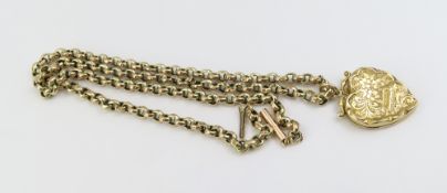A gold heart shaped back and front locket