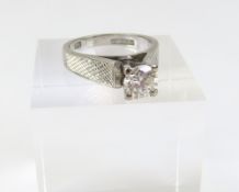 A white gold diamond solitaire ring, the round bri