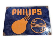 A rectangular enamel sign advertising 
