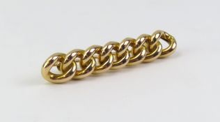 A fixed curb link brooch, composed of seven rounde