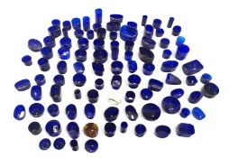 A large tub of blue glass cruet and other containe