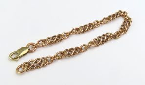 A 9ct rose gold Celtic knot link bracelet