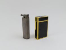 A vintage white metal Dunhill lighter, the body ri