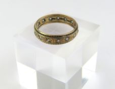 A 9ct gold full eternity ring, with star set