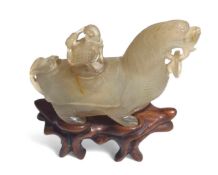 A translucent hardstone figure of a mythical beast