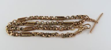 A 9ct rose gold fancy link watch chain, with a T b