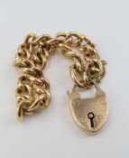 A gold polished curb link bracelet,