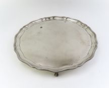 A silver salver with beaded