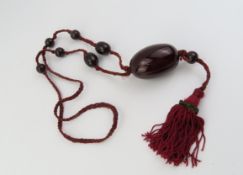An unusual early 20th century cherry amber necklac