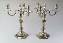 A pair of silver candelabra