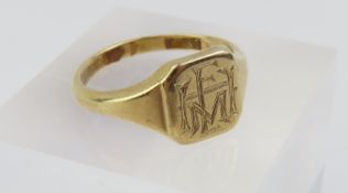 A 9ct gold square head signet ring, engraved with