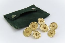 A set of seven yellow gold buttons, three large an