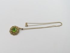 An early 20th century peridot and split pearl pend