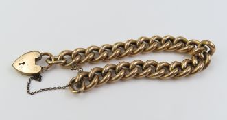 A rolled gold curb link bracelet, with a padlock c