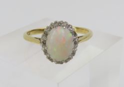 An early 20th century white opal and diamond chip
