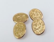 A pair of 9ct rose gold cufflinks with engraved fl