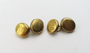 A pair of unmarked yellow metal mourning cufflinks