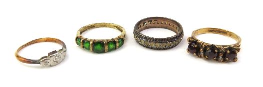 A 9ct gold green stone (possibly garnets) ring, th