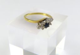An 18ct gold sapphire and white stone dress ring,