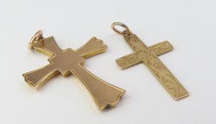 A 9ct gold cross pendant with minimal engraving an
