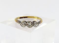 An early 20th century three stone diamond ring, th