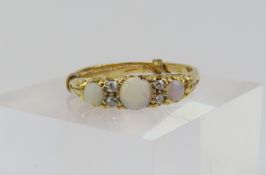 A 19th or early 20th century 18ct gold white opal