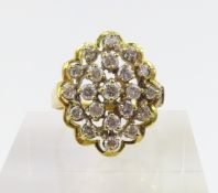 An 18ct gold diamond cluster style ring, the small