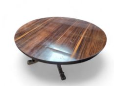 A Regency rosewood tilt top dining table, with lar