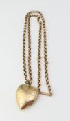 A 9ct gold heart shaped locket, 2.5cm long includi