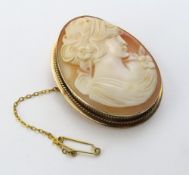 A 9ct gold shell cameo brooch comprising a female