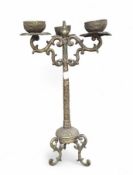 A tall Balinese brass candlestick holder, with scr