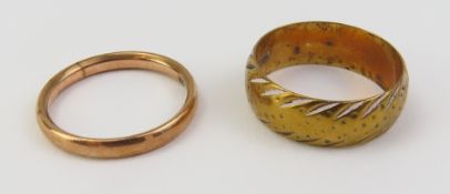 A 9ct rose gold wedding band made by H Aston Ltd i
