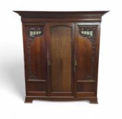 An Art Nouveau three section wardrobe