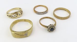 A 9ct gold patterned band ring, finger size R; a 9