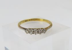 A diamond five stone ring, set with claws, marked
