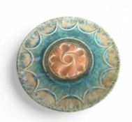 Ruskin - a pottery circular wall plate, with yello