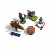 A vintage Tokyo Plaything Shokai (TPS) tin clockwo