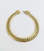 A gold flat curb link bracelet, market '585', with