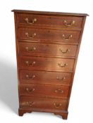 A reproduction chest of seven long drawers