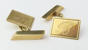 A pair of 9ct gold cufflinks engraved with the let