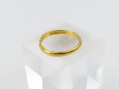 A 22ct gold wedding band, made by Samuel Hope in 1