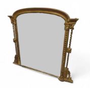 A heavy Victorian carved gilt wood and plaster ove