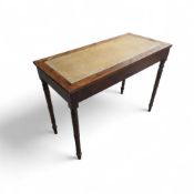 A yew writing table in the Regency style; rectangu